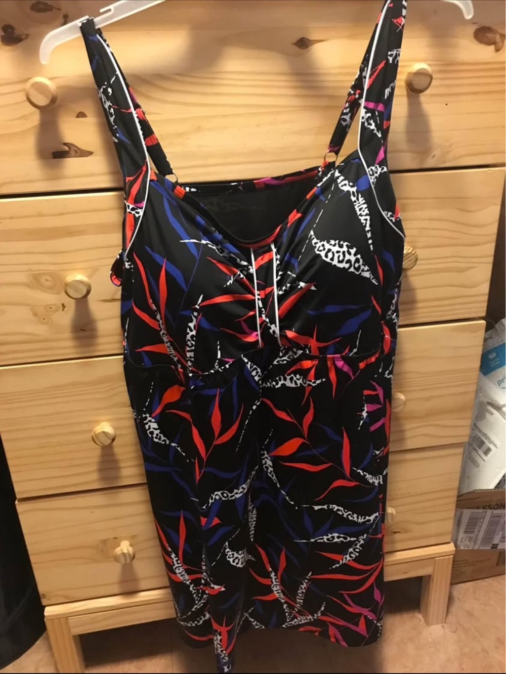 Woman Within Black One-Piece Swimsuit with Red & Blue Leaf Print